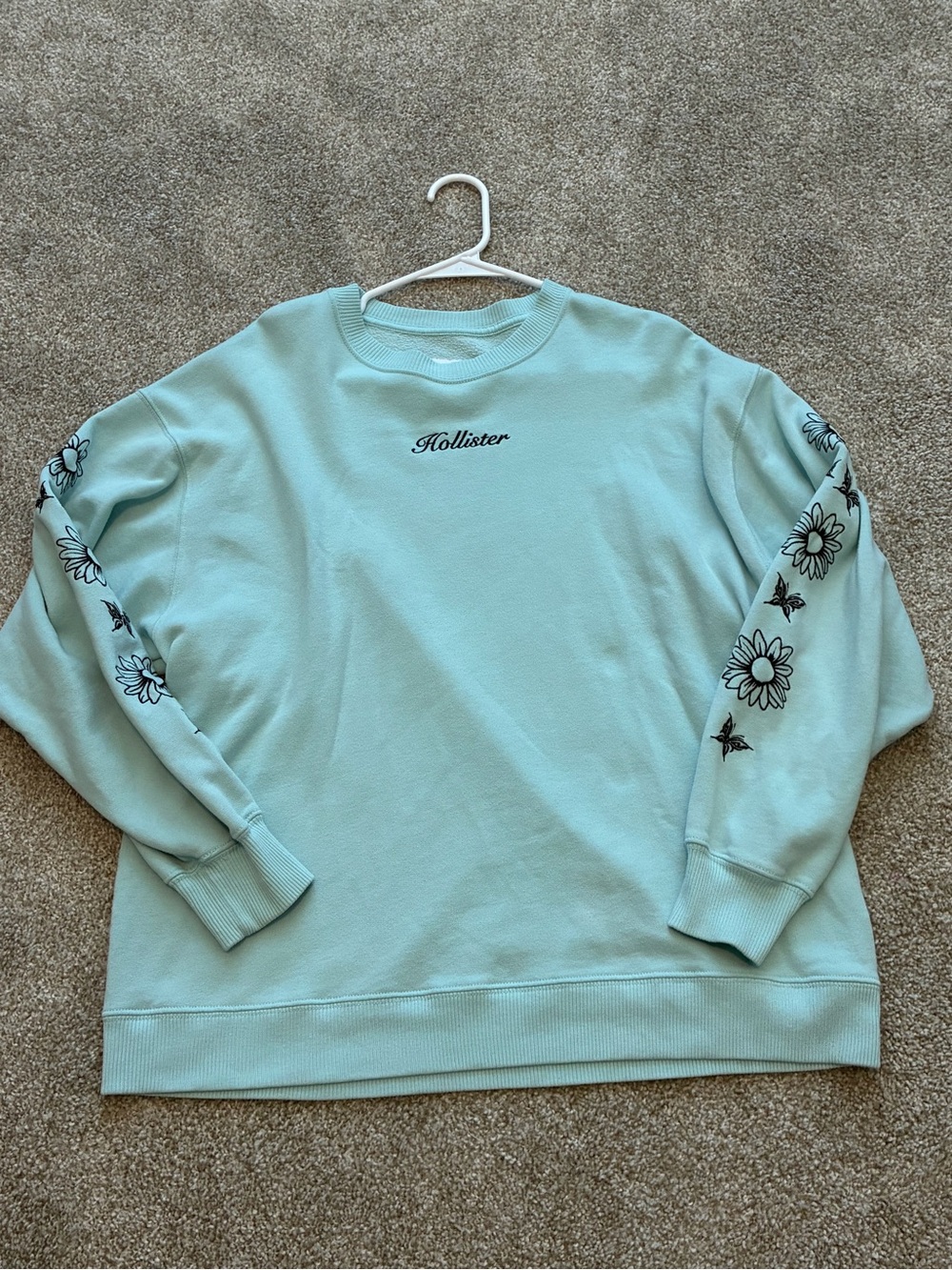 Hollister Mint Green Crewneck Sweatshirt with Black Floral design Sleeves